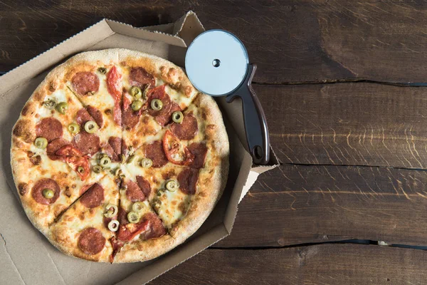 Delicious pizza on table — Stock Photo, Image