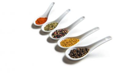 Various spices in spoons  clipart