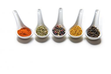 Various spices in spoons  clipart