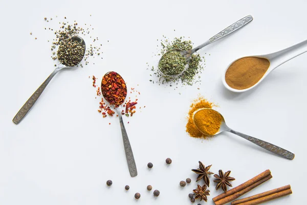Various spices in spoons — Stock Photo, Image