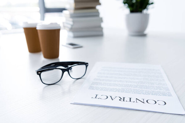 eyeglasses and business documents