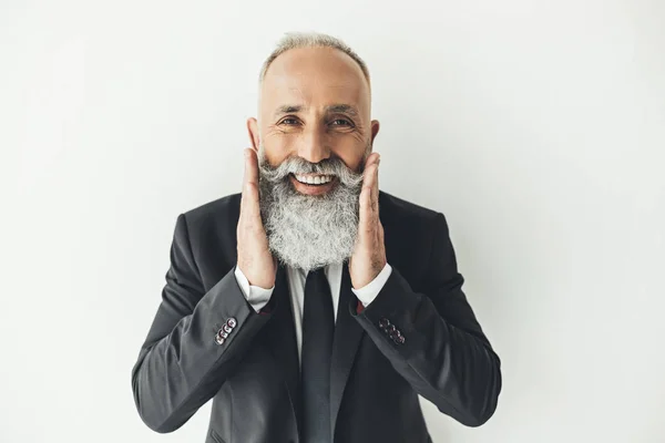 Hombre de negocios tocándose la barba —  Fotos de Stock