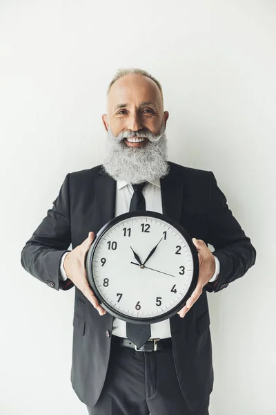 Mature businessman with clock — Stock Photo, Image