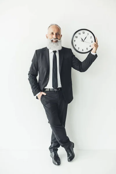 Mature businessman with clock — Stock Photo, Image