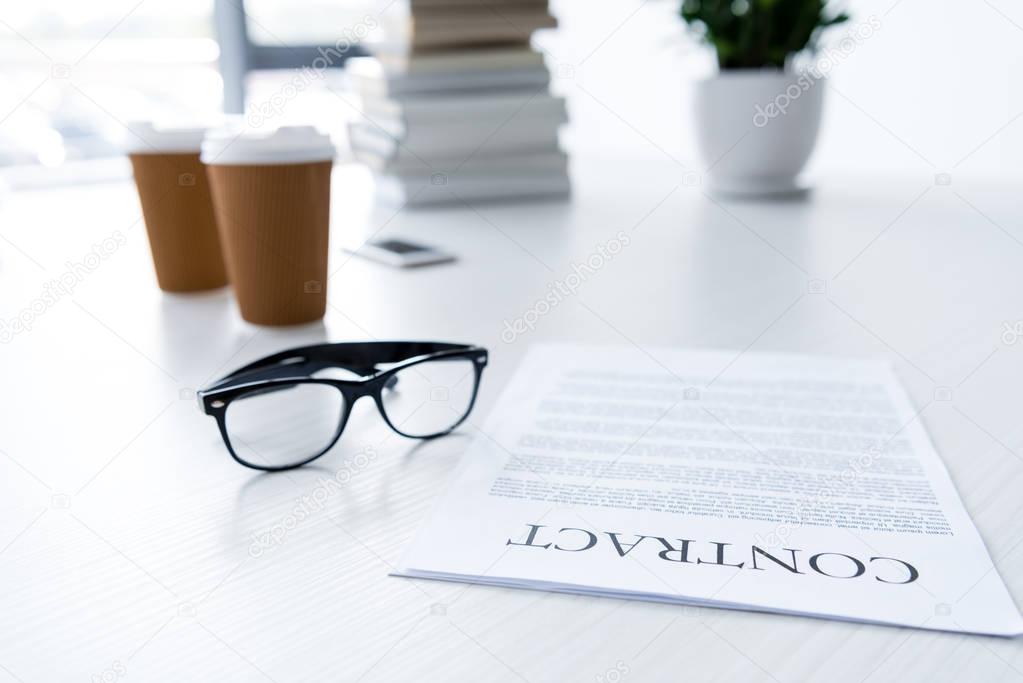 eyeglasses and business documents