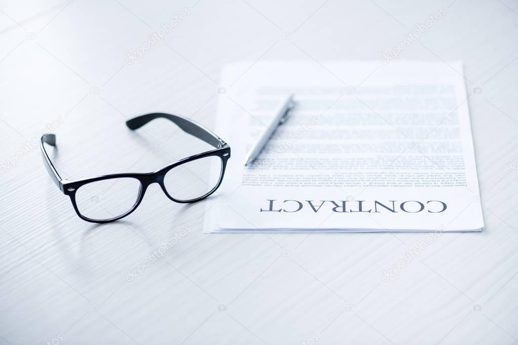eyeglasses and business documents