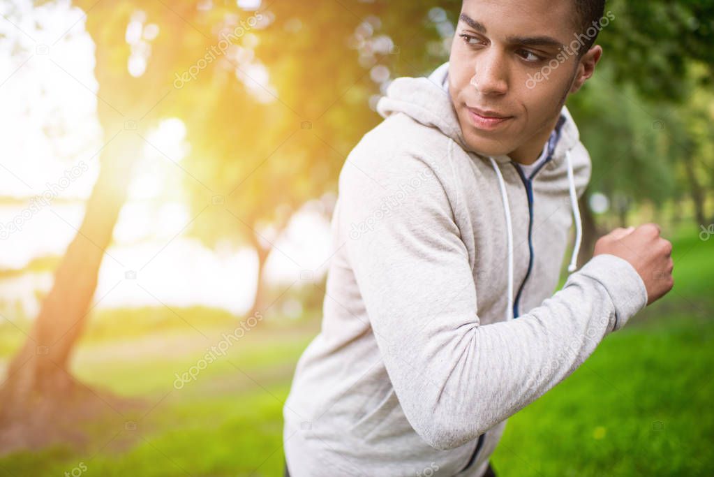 african american sportsman running in park