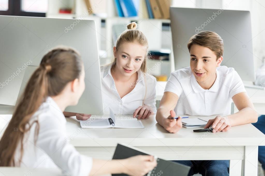 teenagers during lesson in classroom