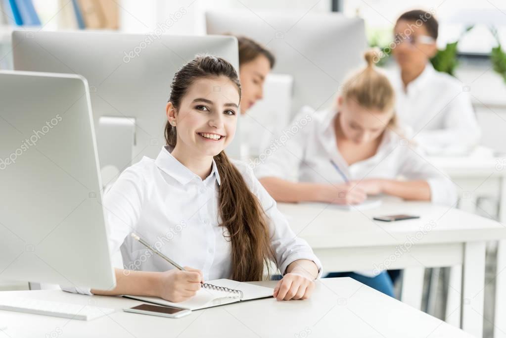 teenage girl studying in classroom