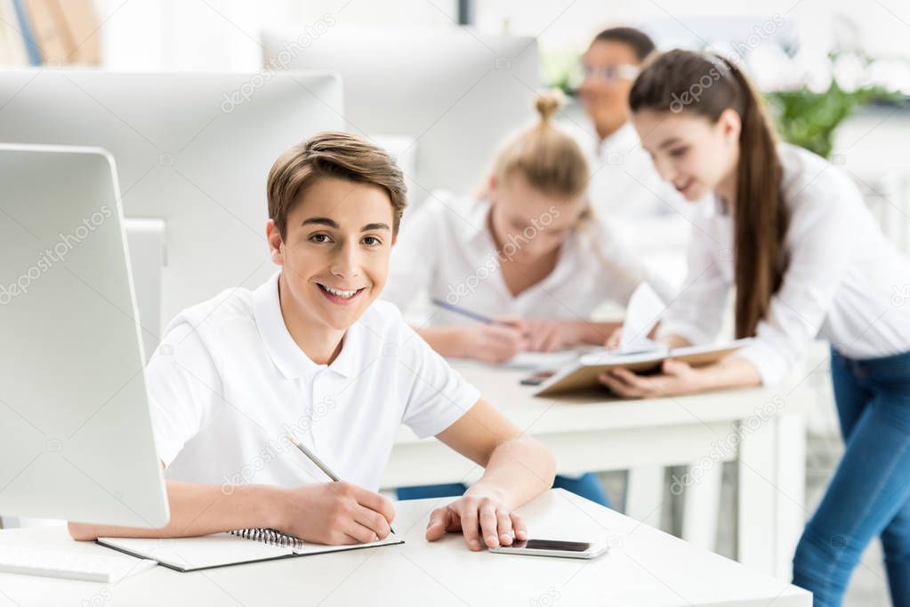 smiling teenager in classroom