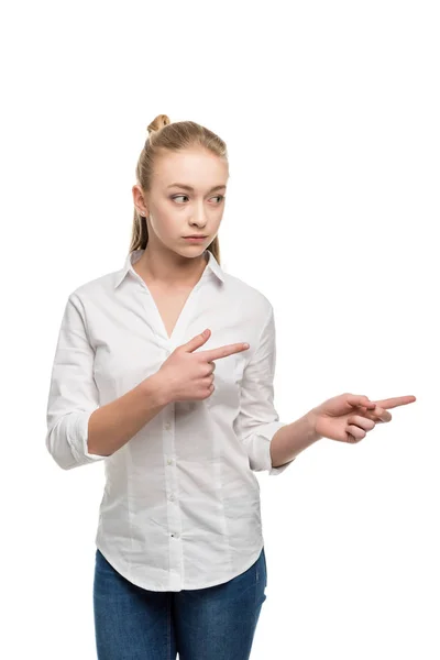 Caucasian teenage girl pointing away — Stock Photo, Image