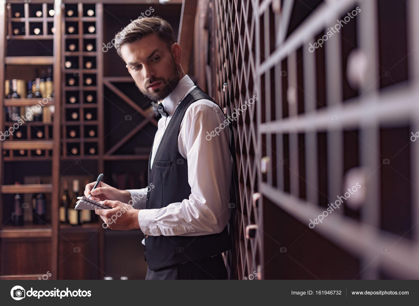 Sommelier in wine cellar — Stock Photo © IgorTishenko 161946732