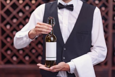 sommelier with bottle of wine clipart