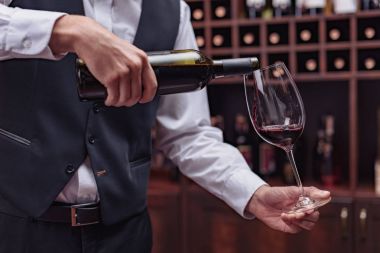 sommelier pouring red wine clipart