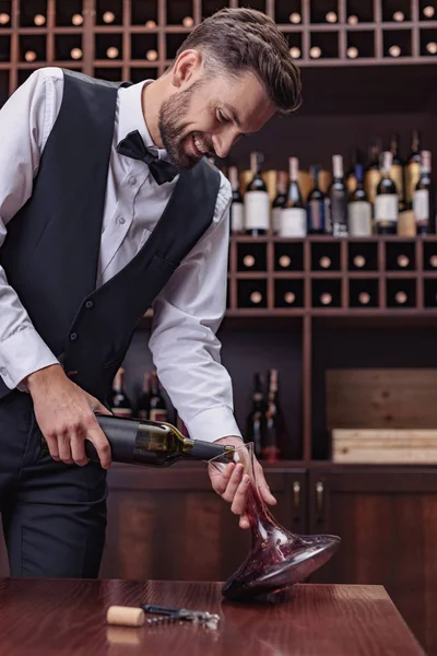 Sommelier pouring red wine — Stock Photo, Image