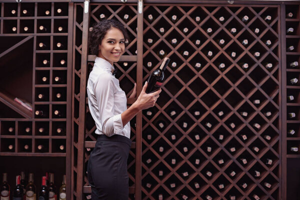 sommelier in wine cellar