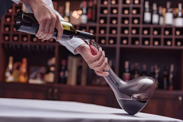 Sommelier pouring red wine — Stock Photo, Image