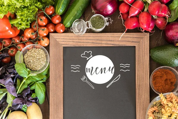 Chalkboard with group of fresh vegetables — Stock Photo, Image