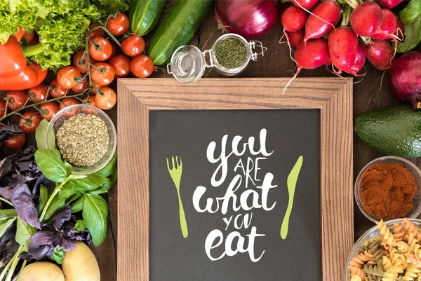 Chalkboard with group of fresh vegetables — Stock Photo, Image