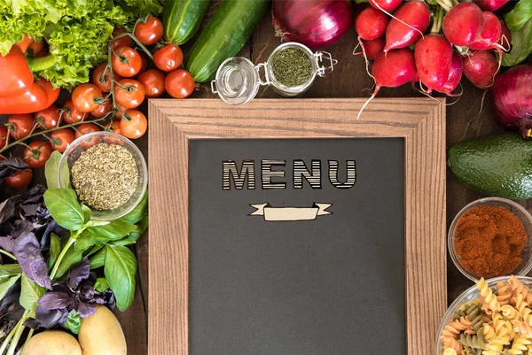 Chalkboard with group of fresh vegetables — Stock Photo, Image