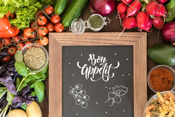 Chalkboard with group of fresh vegetables — Stock Photo, Image