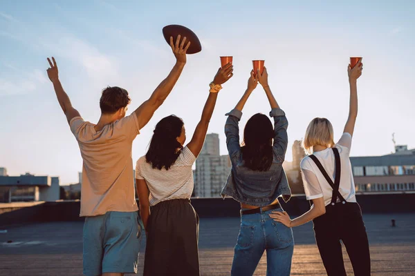 Group of happy friends on roof — Stock Photo, Image