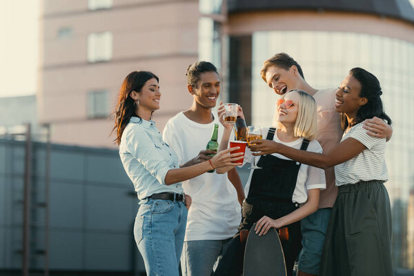 friends drinking alcohol on roof
