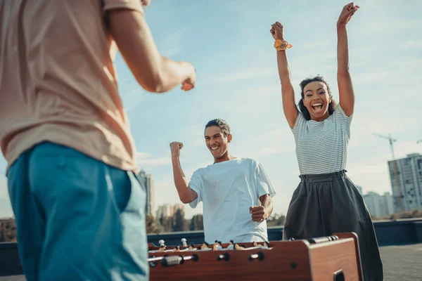 Couple celebrating victory in kicker — Stock Photo, Image