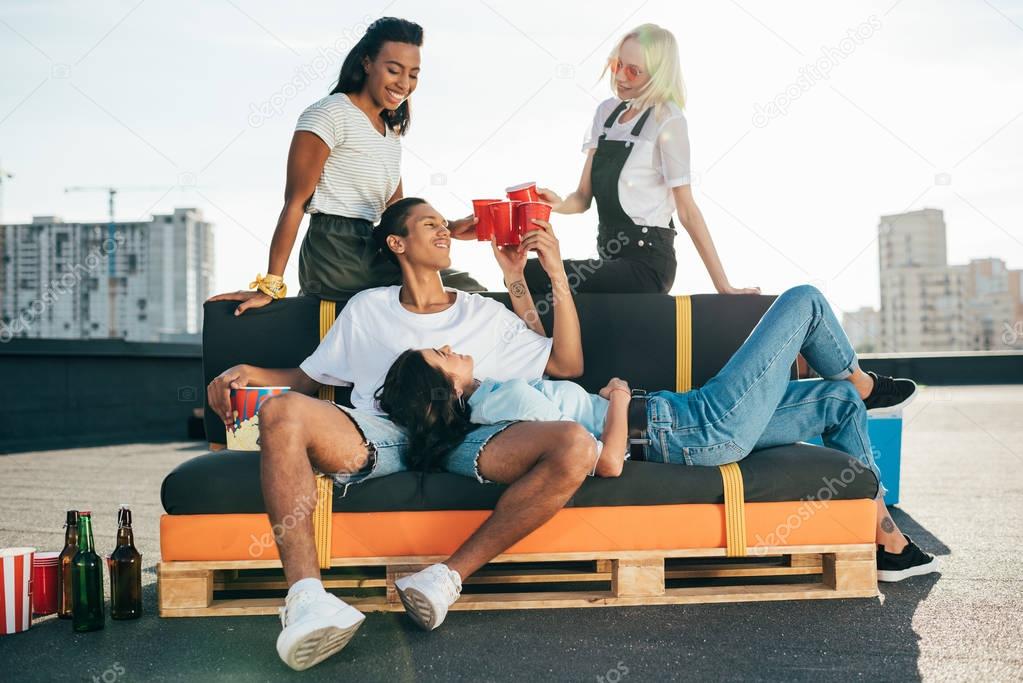 friends relaxing on roof