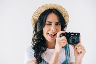 winking woman with photo camera in hands clipart