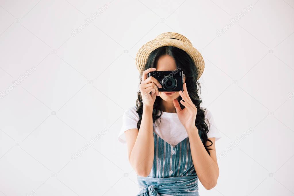 woman taking picture on photo camera