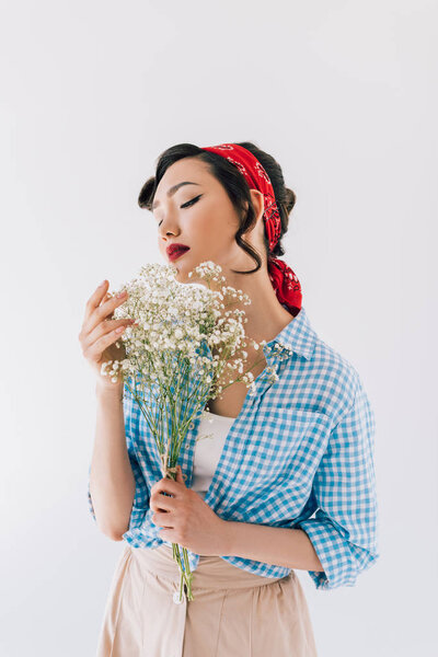 sensual asian woman with bouquet of flowers