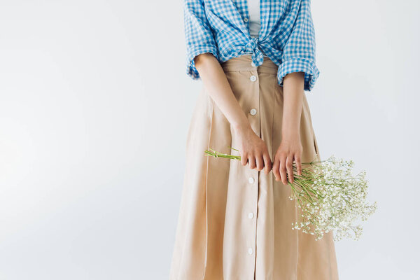 woman holding bouquet of flowers