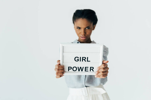 african american woman with girl power board