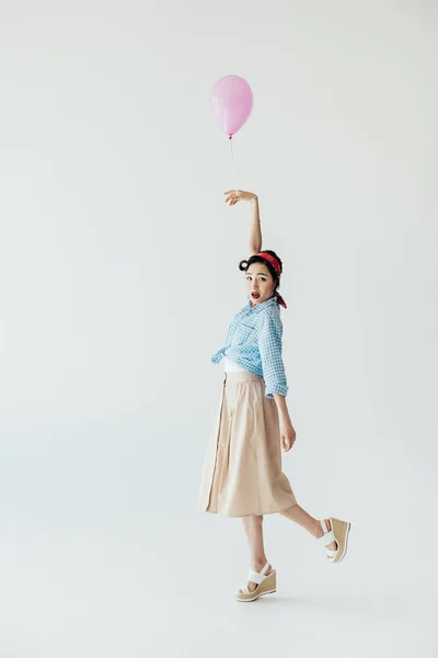 Shocked asian woman with balloon — Stock Photo, Image