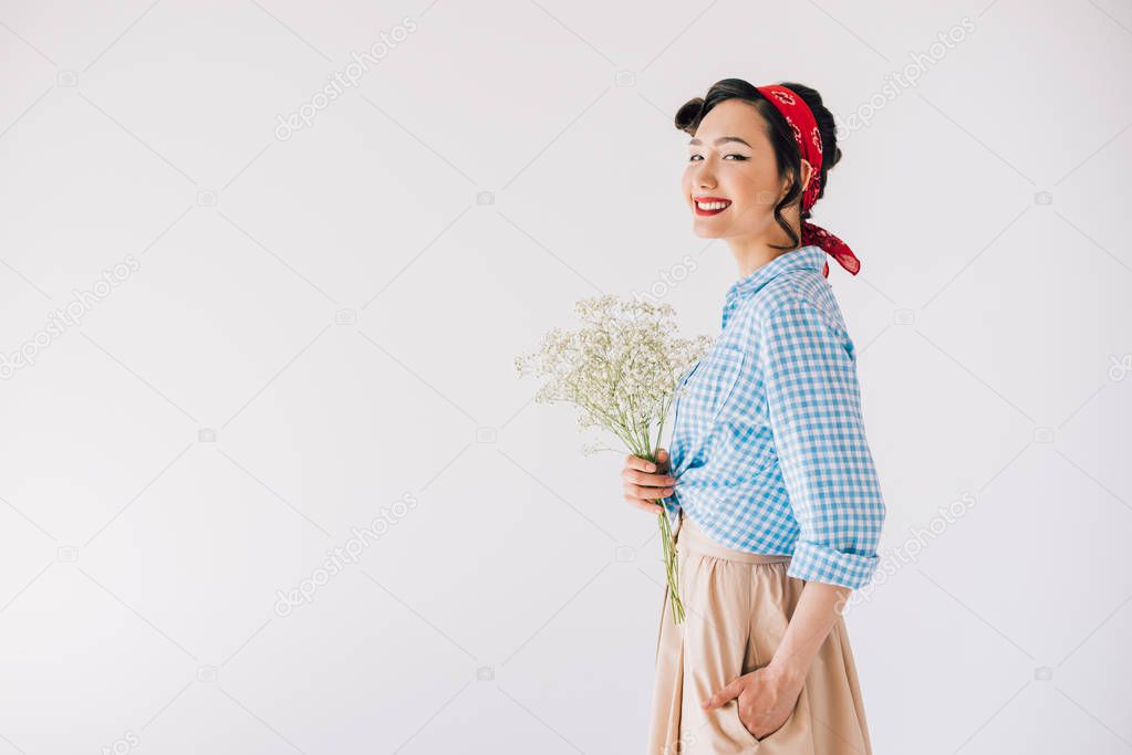 smiling asian woman with bouquet of flowers
