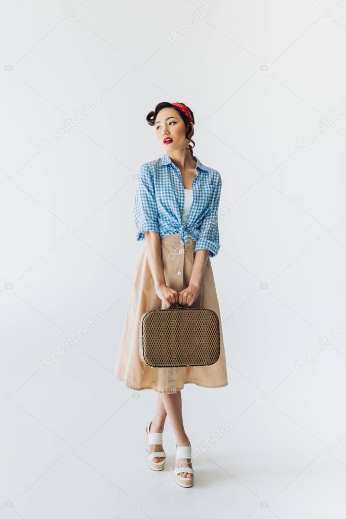 stylish asian woman with suitcase