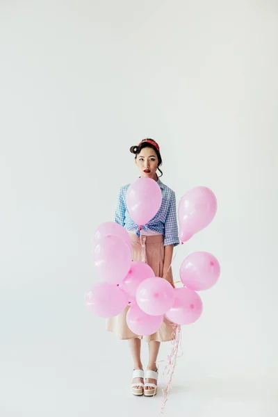 Asian woman holding balloons — Stock Photo, Image