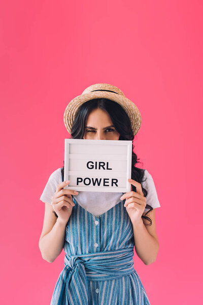 woman with girl power board in hands