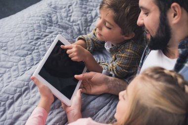 father and kids with tablet clipart