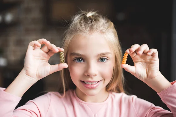 Little kid with macaroni — Stock Photo, Image