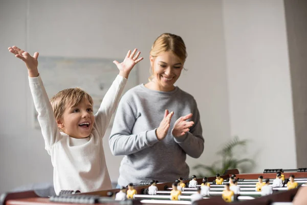 Mother and son playing table football — Stock Photo, Image
