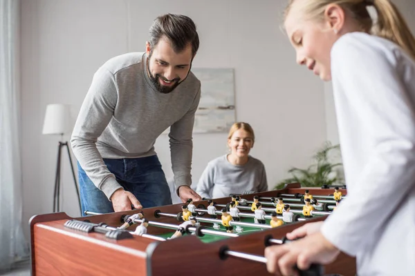 Family playing table football — Stock Photo, Image