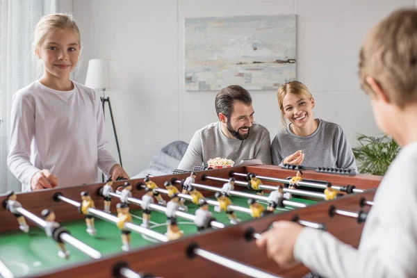 Family playing table football together — Stock Photo, Image