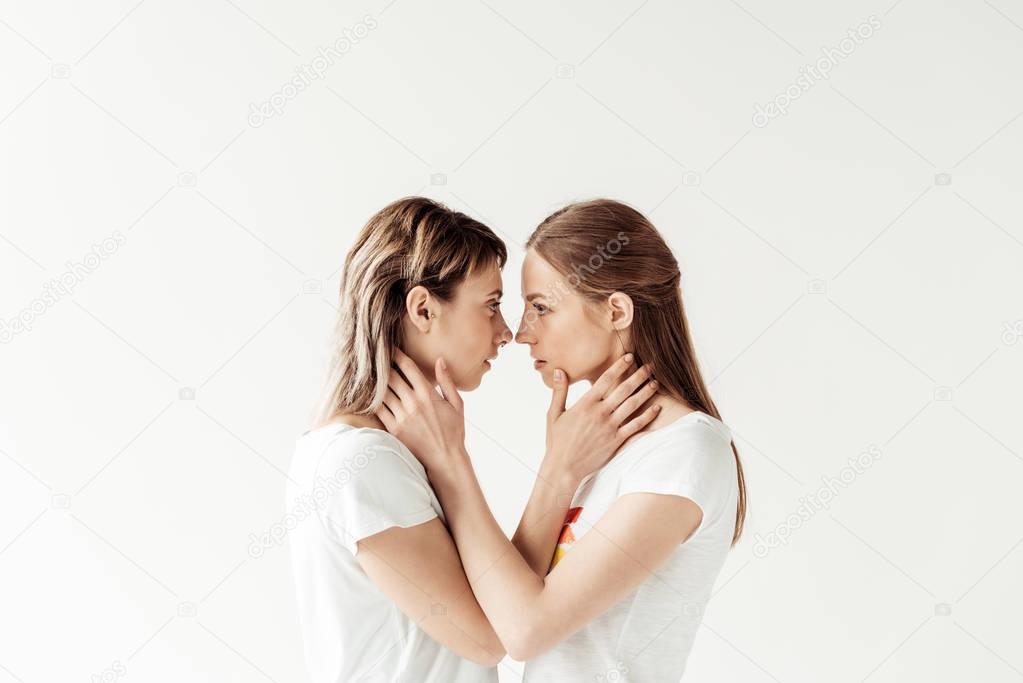 Women hugging and standing face to face