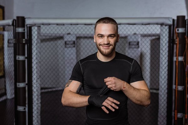 boxer wrapping hand with bandage