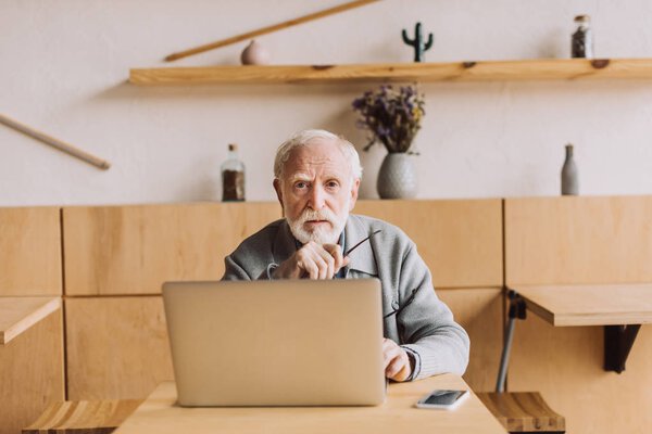 senior man with laptop
