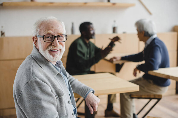 senior man sitting in cafe