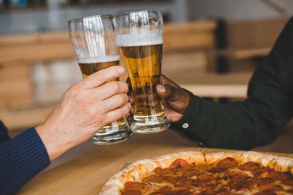 friends clinking glasses of beer