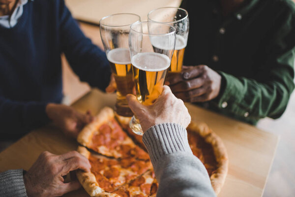 friends clinking glasses of beer